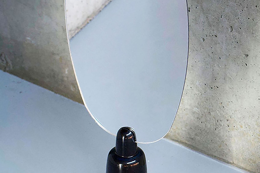 Mirror with indigo lac. The telescopic shapes are a result of assembling different size wood parts to save material.