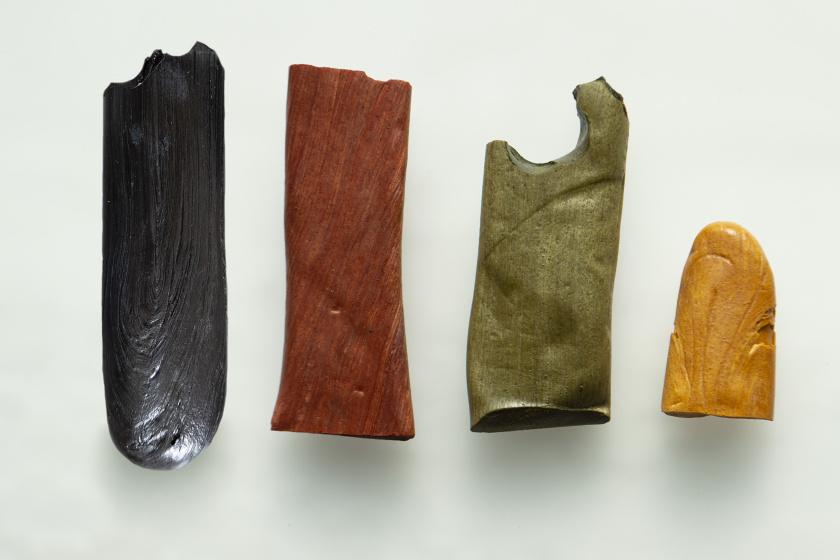 Instead of using solvents, the resin is heated, dyed with natural pigments such as indigo, turmeric and madder root and formed into solid sticks. 